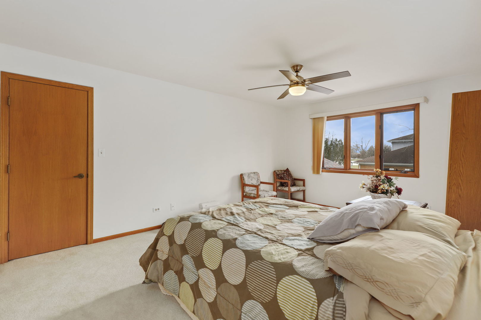 780 94th Street Burr Ridge, IL 60527 - Photo 27 of 53 a bedroom with a bed and window