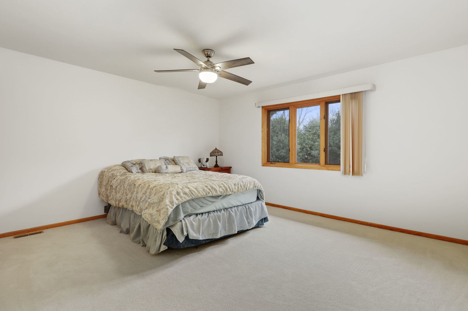 780 94th Street Burr Ridge, IL 60527 - Photo 28 of 53 a bedroom with a bed and a window