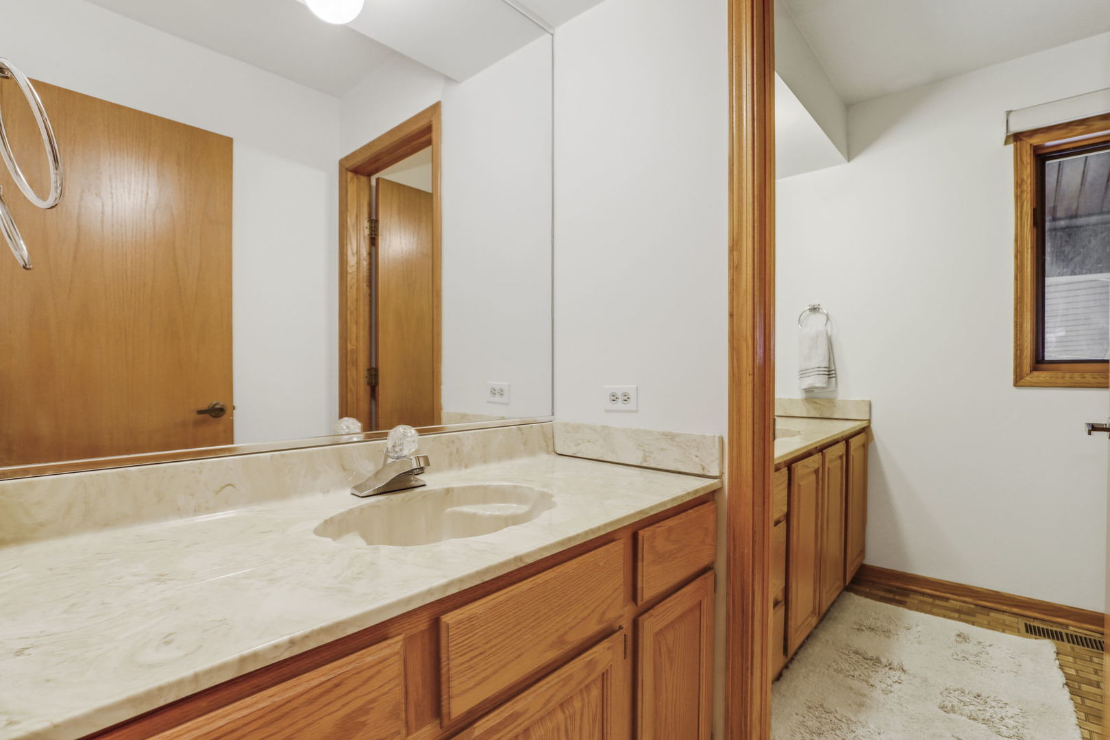 780 94th Street Burr Ridge, IL 60527 - Photo 32 of 53 a bathroom with a sink and a mirror