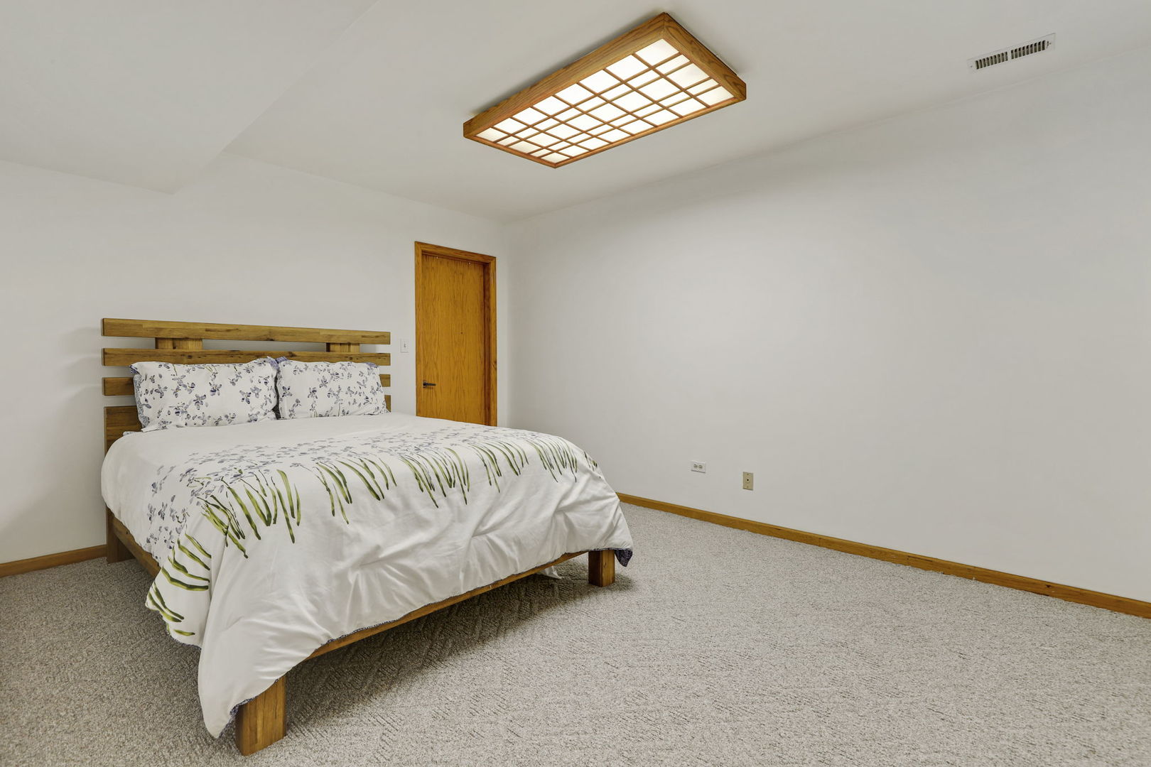 780 94th Street Burr Ridge, IL 60527 - Photo 41 of 53 a bedroom with a bed and a window