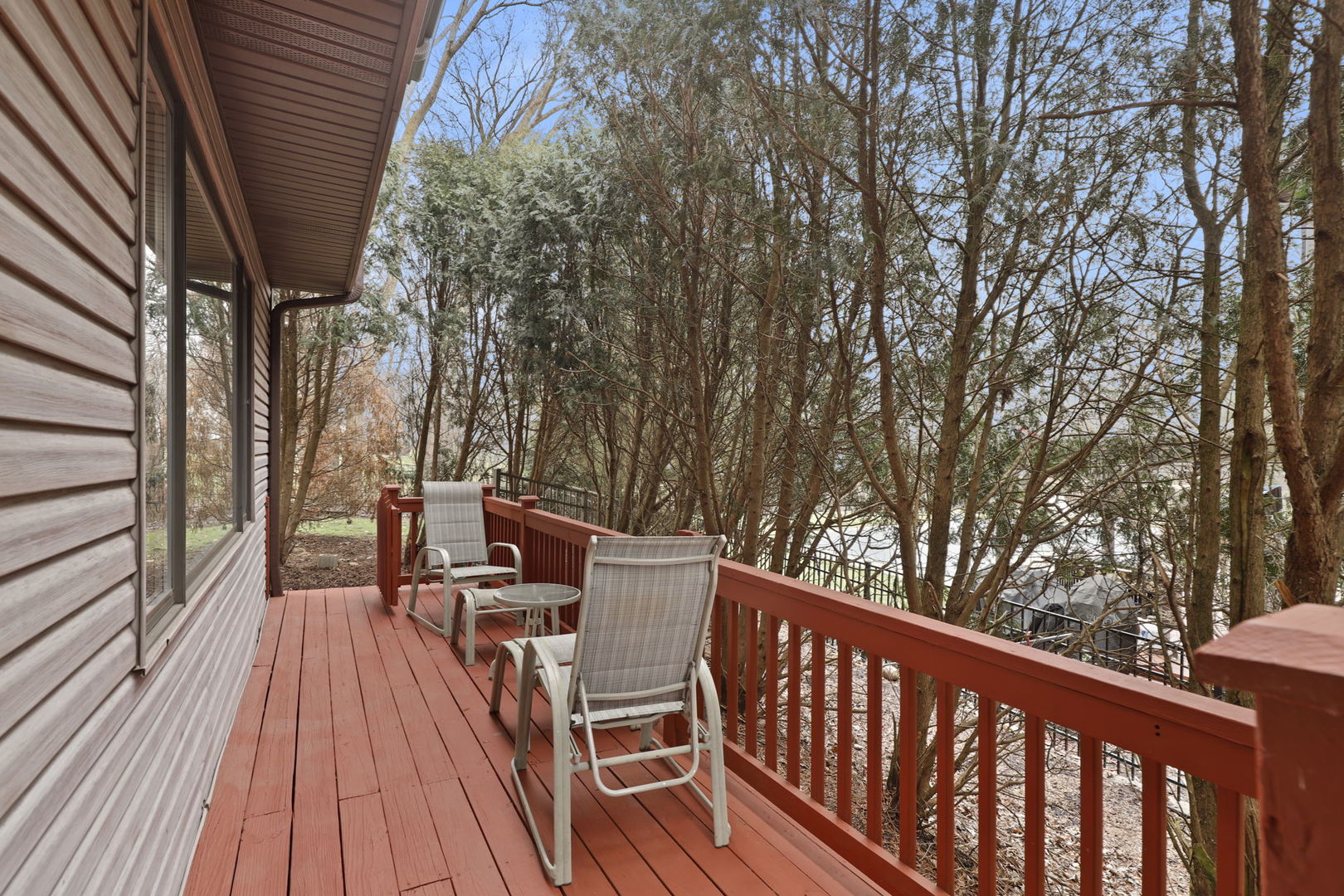 780 94th Street Burr Ridge, IL 60527 - Photo 46 of 53 a view of balcony with wooden floor and outdoor seating