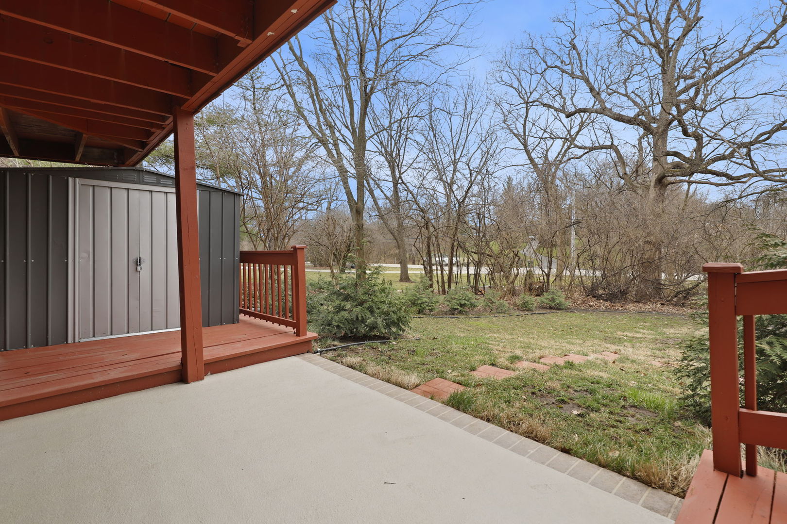 780 94th Street Burr Ridge, IL 60527 - Photo 47 of 53 a view of a backyard with wooden fence