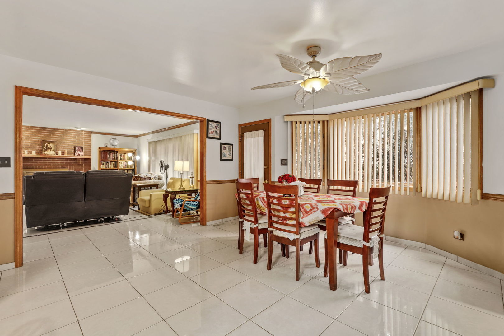 780 94th Street Burr Ridge, IL 60527 - Photo 6 of 53 a dining room with furniture and chandelier fan