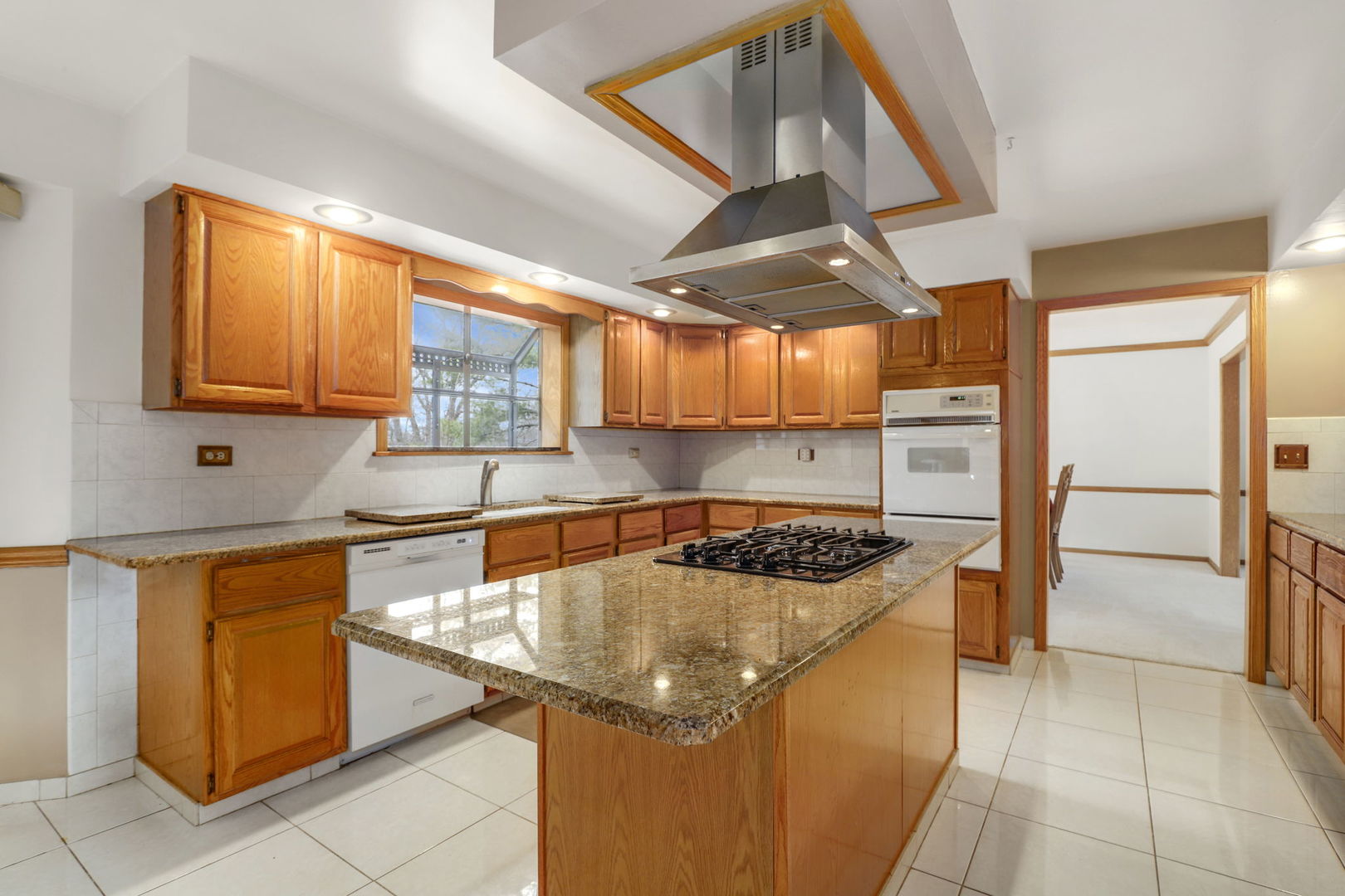 780 94th Street Burr Ridge, IL 60527 - Photo 7 of 53 a kitchen that has a sink and a stove in it