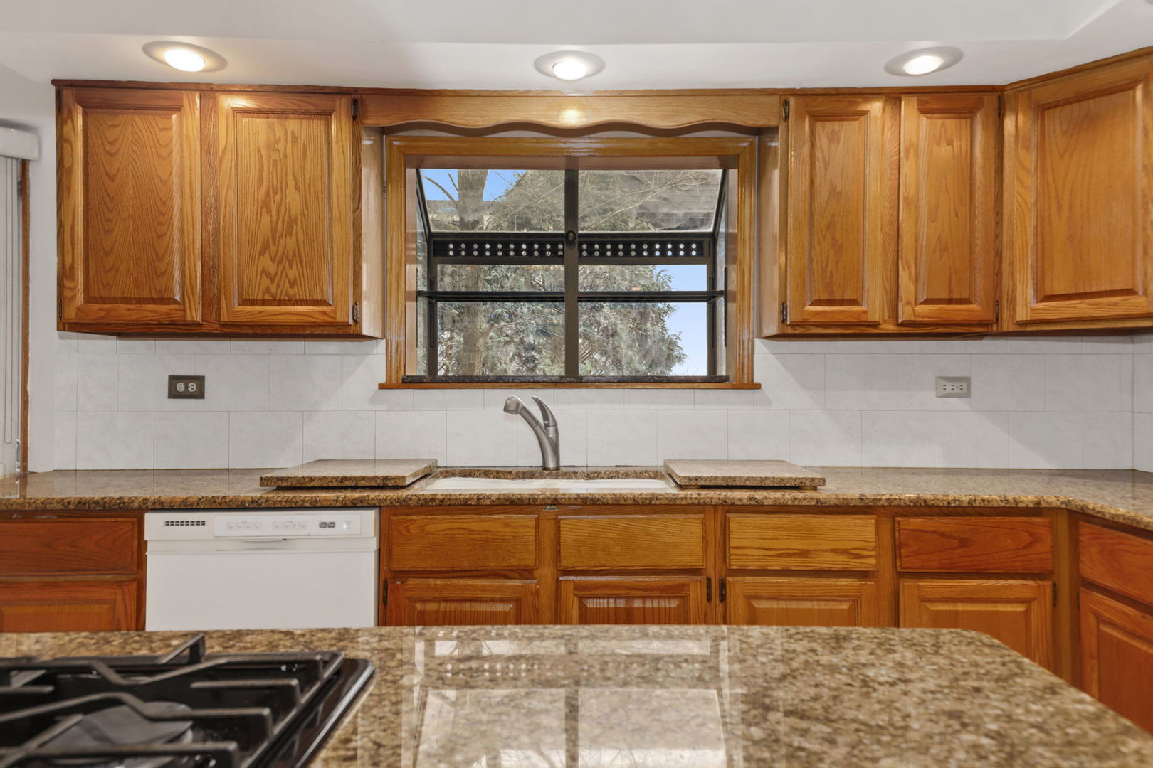 780 94th Street Burr Ridge, IL 60527 - Photo 9 of 53 a kitchen with stainless steel appliances granite countertop a sink and a cabinets