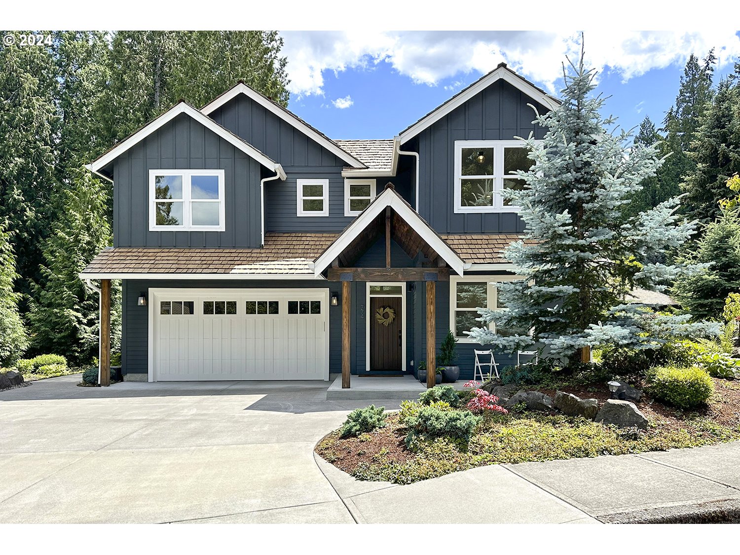 774 Southeast 25th Street Gresham, OR 97080 - Photo 1 of 39 a front view of a house with a yard and garage