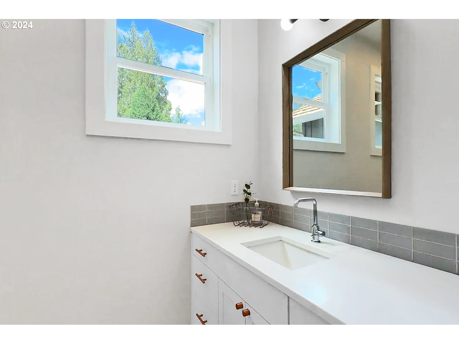 774 Southeast 25th Street Gresham, OR 97080 - Photo 29 of 39 a bathroom with a sink and a mirror