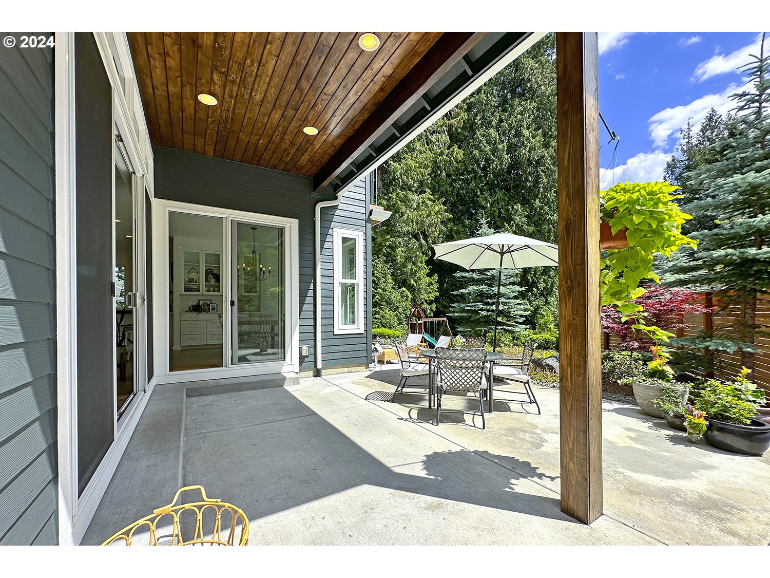 774 Southeast 25th Street Gresham, OR 97080 - Photo 31 of 39 a view of a patio with table and chairs and potted plants
