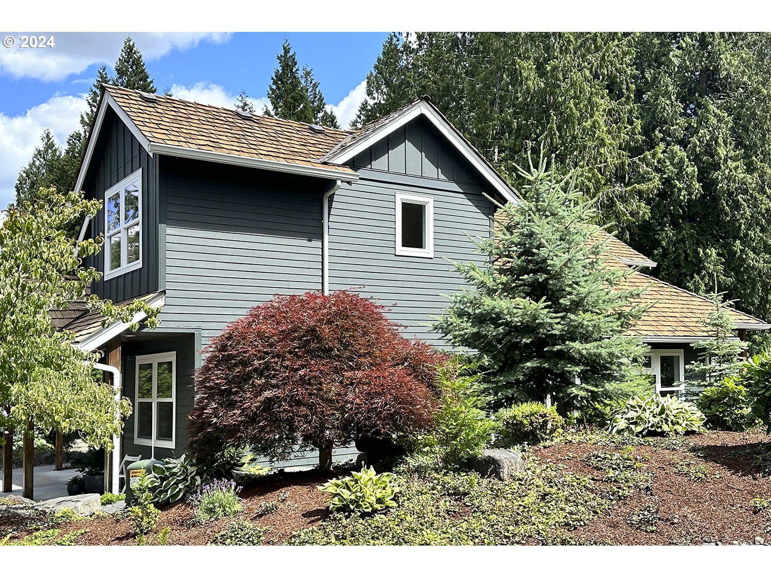 774 Southeast 25th Street Gresham, OR 97080 - Photo 38 of 39 a view of a house with a small yard and plants