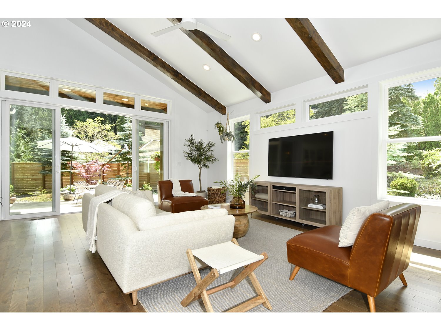 774 Southeast 25th Street Gresham, OR 97080 - Photo 4 of 39 a living room with furniture a large window and a flat screen tv