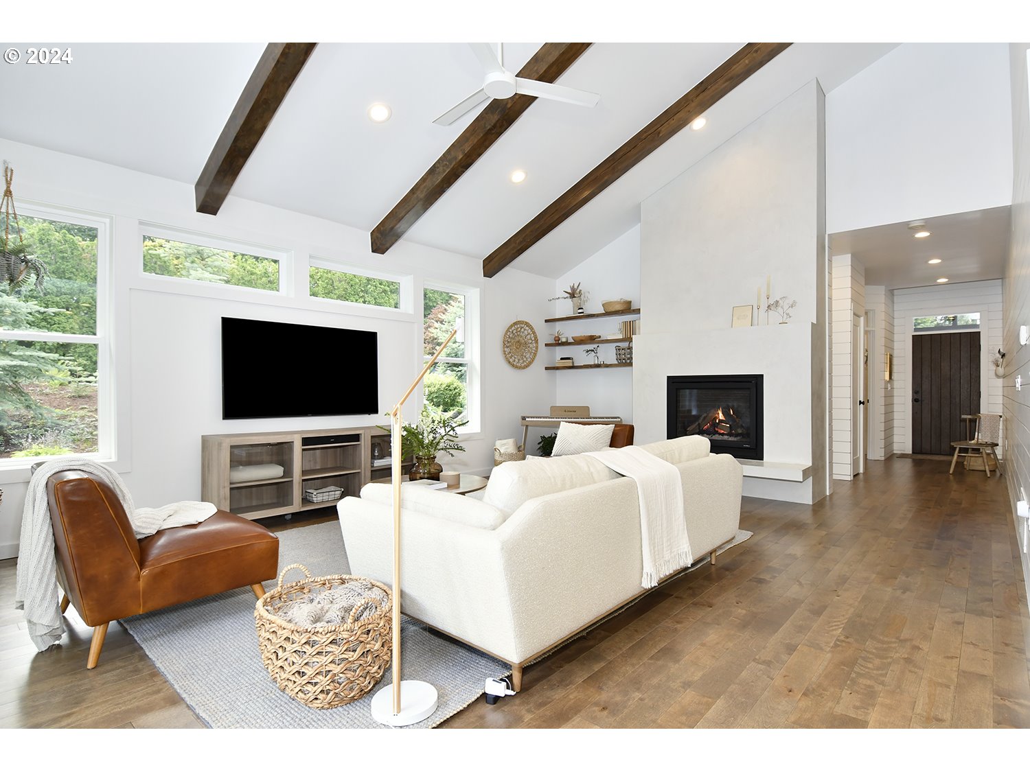 774 Southeast 25th Street Gresham, OR 97080 - Photo 5 of 39 a living room with furniture a flat screen tv and a fireplace