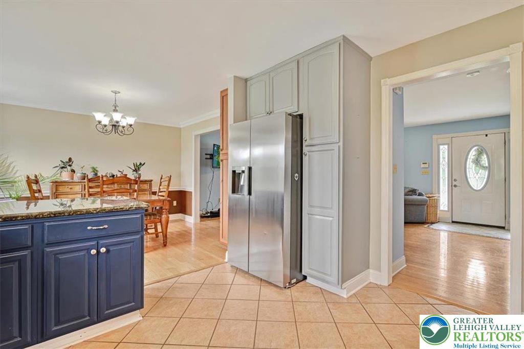 18 Cub Lane Jim Thorpe, PA 18229 - Photo 30 of 58 a kitchen with granite countertop a refrigerator and a stove top oven
