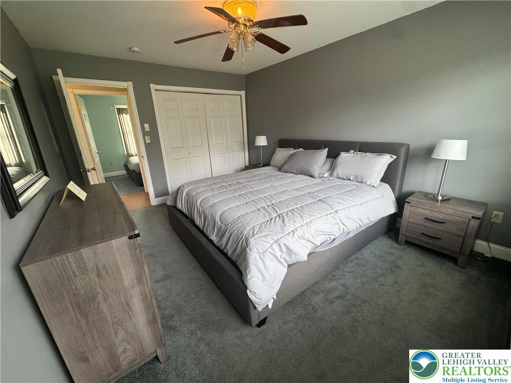 18 Cub Lane Jim Thorpe, PA 18229 - Photo 41 of 58 a bedroom with a bed and a large mirror