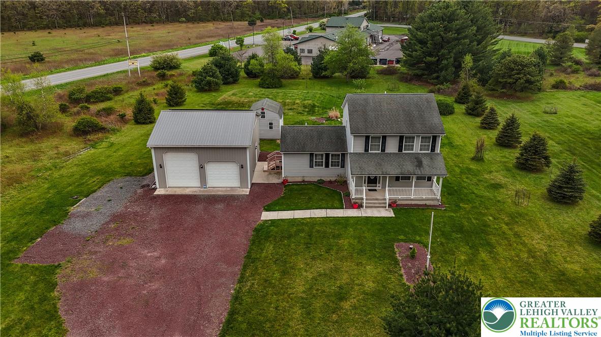 18 Cub Lane Jim Thorpe, PA 18229 - Photo 5 of 58 an aerial view of a house with a yard and lake view