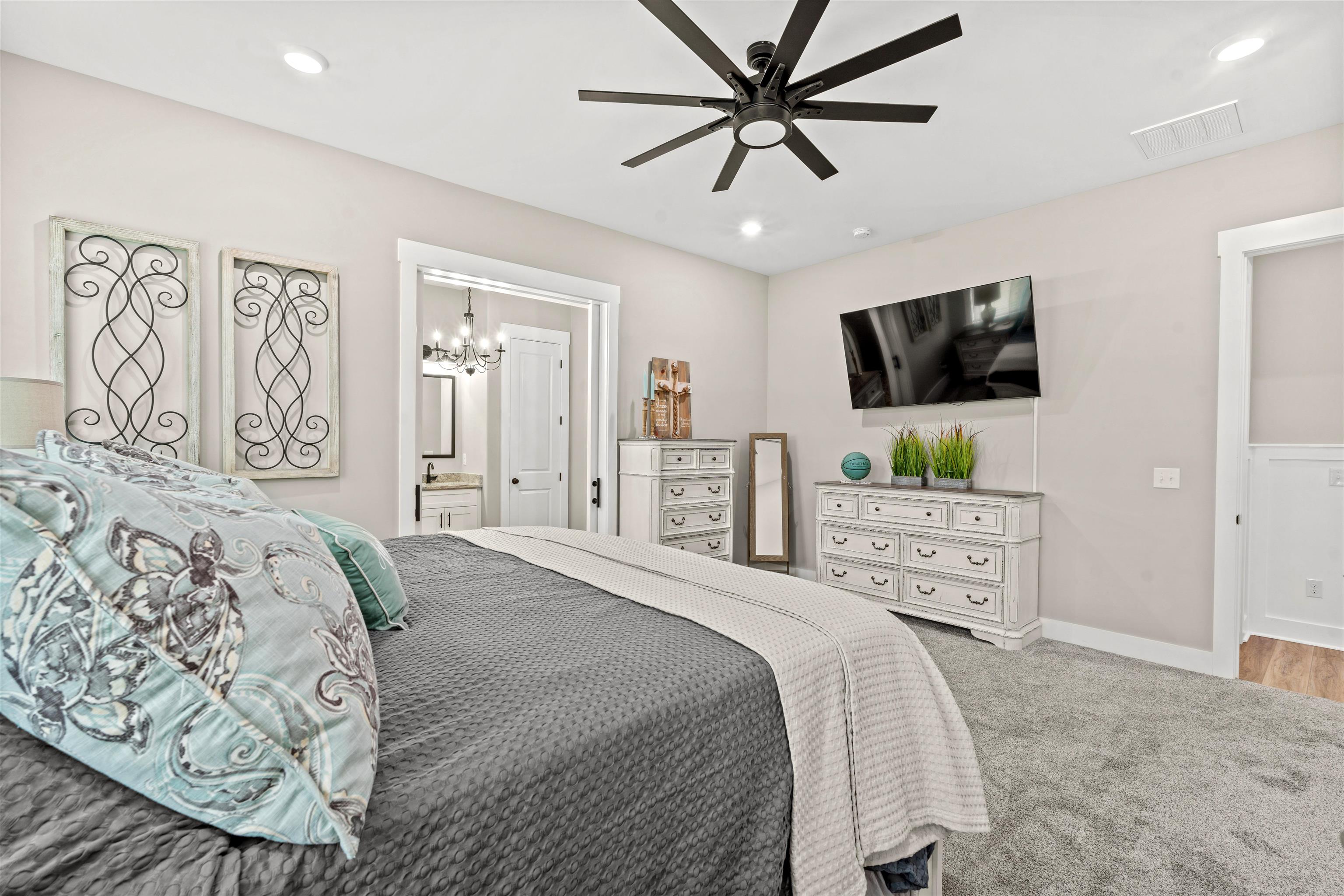 411 Chamberlin Road Myrtle Beach, SC 29588 - Photo 18 of 40 Bedroom featuring a ceiling fan, carpet floors, ensuite bath, and recessed lighting