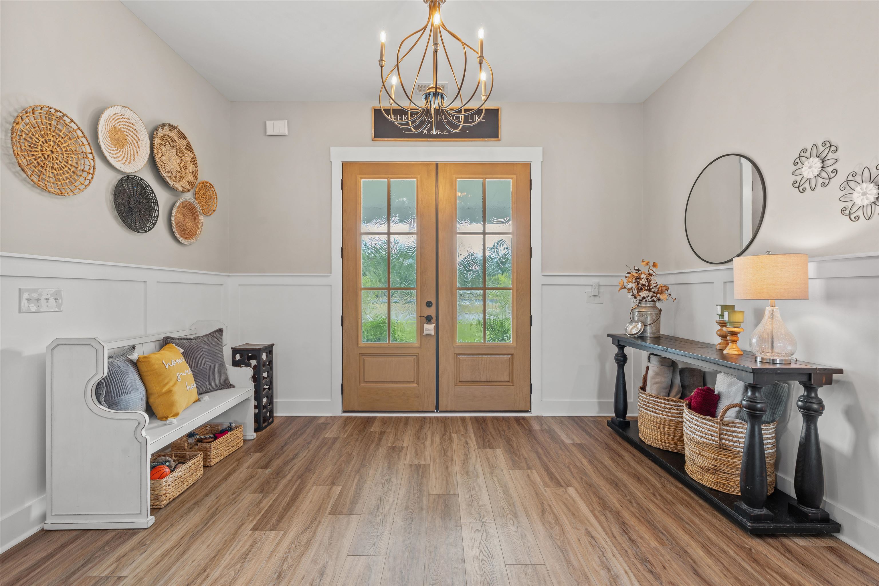411 Chamberlin Road Myrtle Beach, SC 29588 - Photo 2 of 40 Entryway with a wainscoted wall, wood finished floors, a chandelier, a decorative wall, and french doors