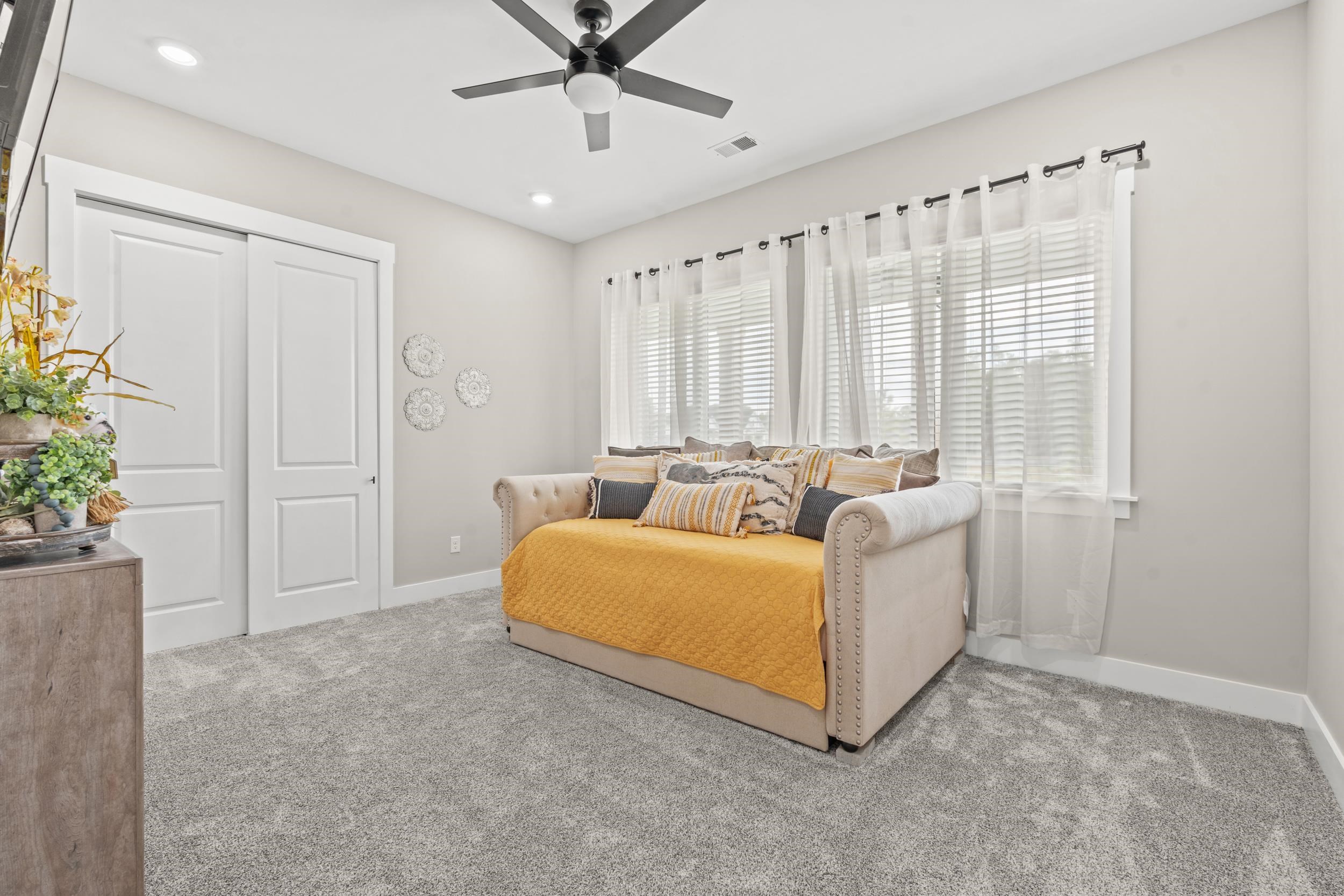 411 Chamberlin Road Myrtle Beach, SC 29588 - Photo 22 of 40 Bedroom with carpet, ceiling fan, and a closet
