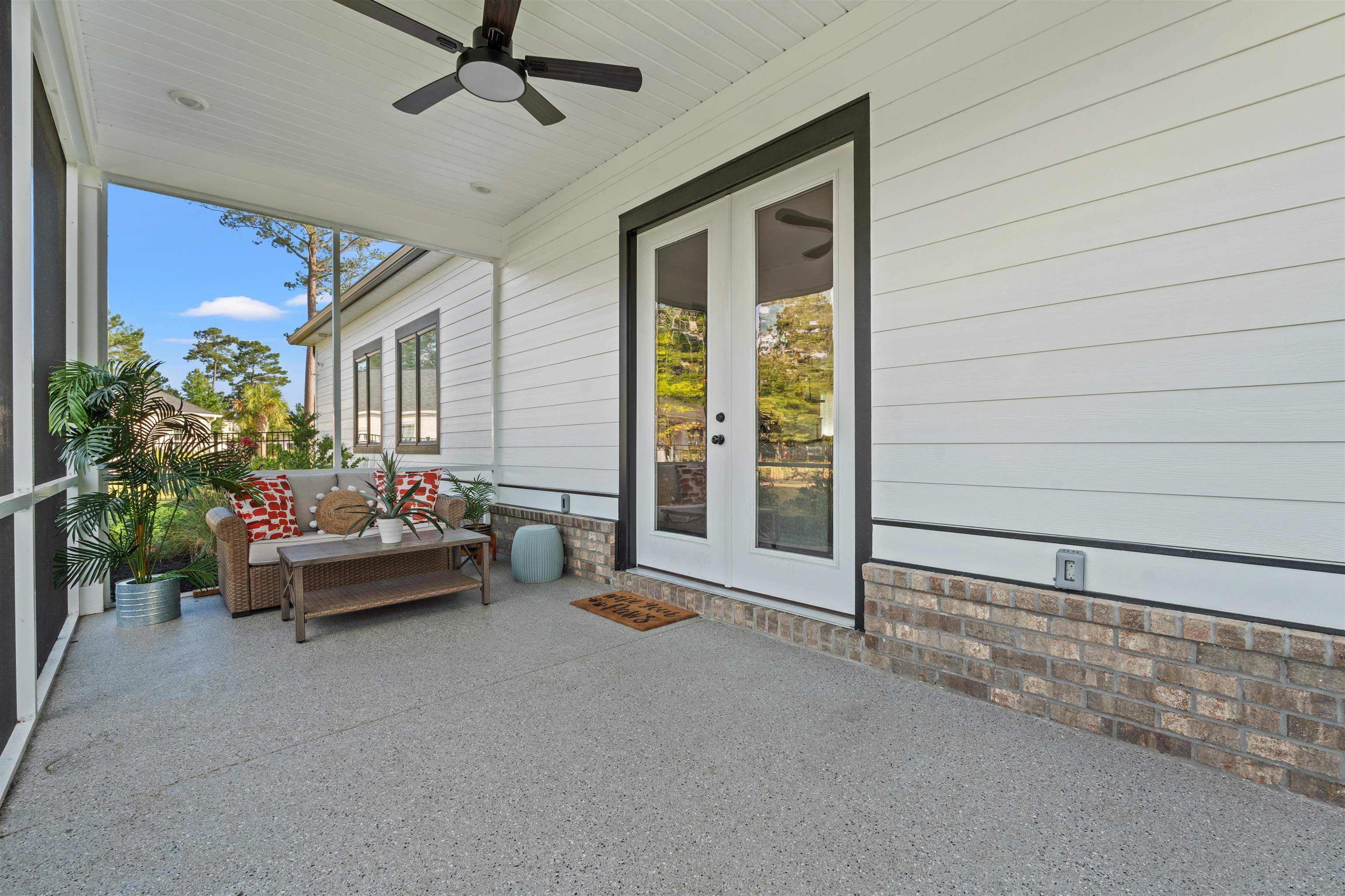 411 Chamberlin Road Myrtle Beach, SC 29588 - Photo 31 of 40 Sunroom with a ceiling fan, french doors, and a patio area