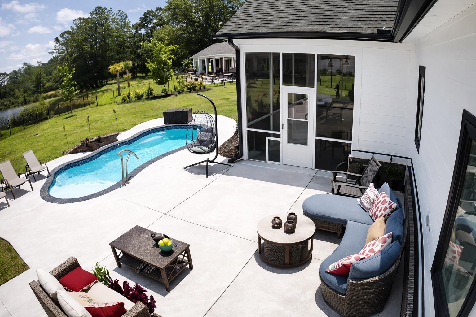 411 Chamberlin Road Myrtle Beach, SC 29588 - Photo 32 of 40 Swimming pool featuring outdoor lounge area, a patio area, and a sunroom