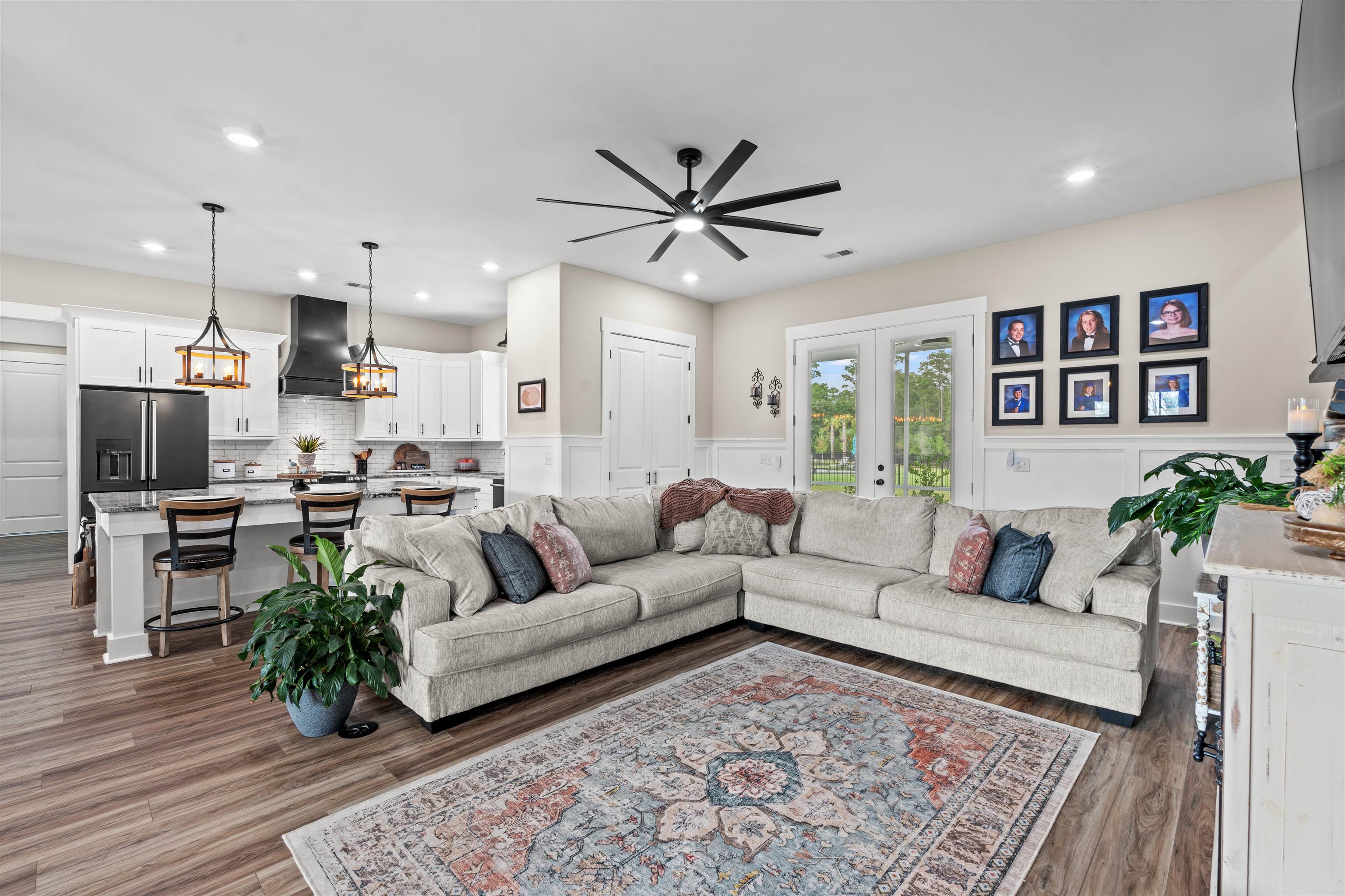 411 Chamberlin Road Myrtle Beach, SC 29588 - Photo 5 of 40 Living area with a wainscoted wall, dark wood finished floors, recessed lighting, and a decorative wall