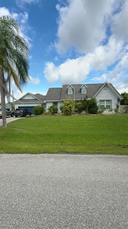 a view of a big yard with palm trees