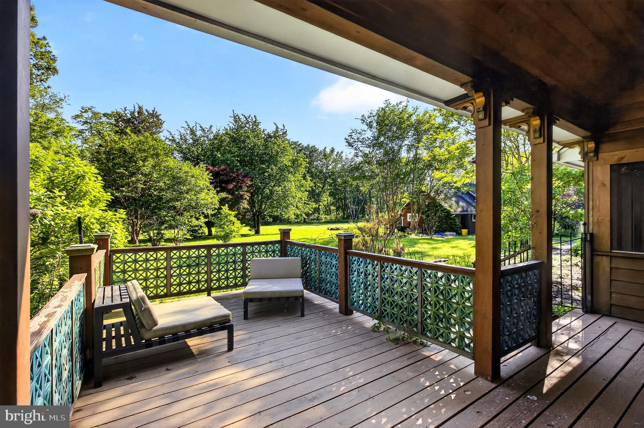 498 Perrineville Road Robbinsville, NJ 08691 - Photo 42 of 59 a view of balcony with couch and wooden floor