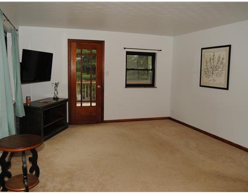 192 Lutz Road Zelienople, PA 16063 - Photo 2 of 15 Den/Family/Great Room. Living room has hardwood under carpet. Door to side porch.
