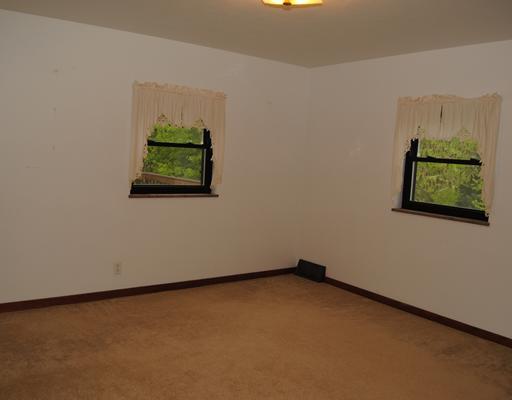 192 Lutz Road Zelienople, PA 16063 - Photo 5 of 15 Master Bedroom. 1st floor bedroom has hardwood under the carpet, two newer windows and large closet.