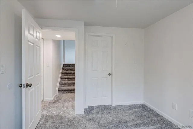 a view of a hallway with stairs