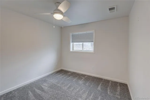 a view of an empty room and closet area