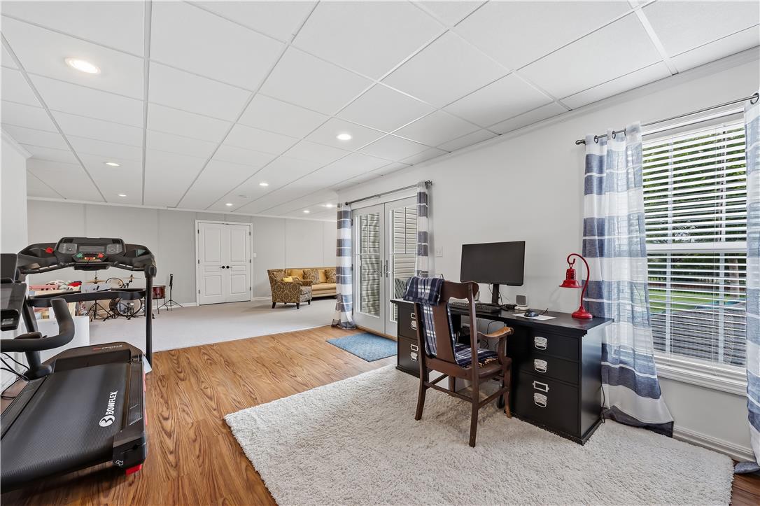 9031 Pathfinder Road Breinigsville, PA 18031 - Photo 53 of 63 Bright and adaptable, this versatile space features a dedicated office nook, a comfortable sitting area, and ample room for fitness equipment.