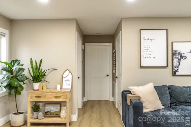 a bathroom with a toilet sink vanity and mirror