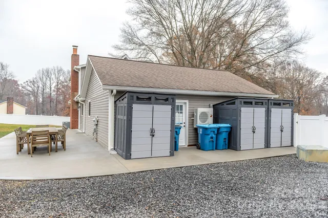 swimming pool view with a seating space