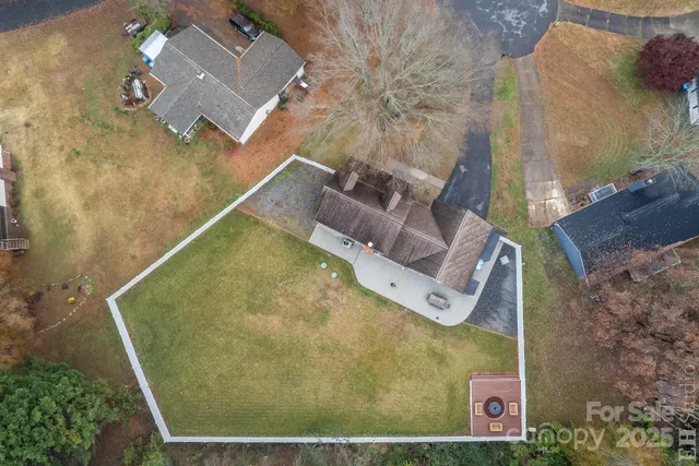 an aerial view of a house with swimming pool