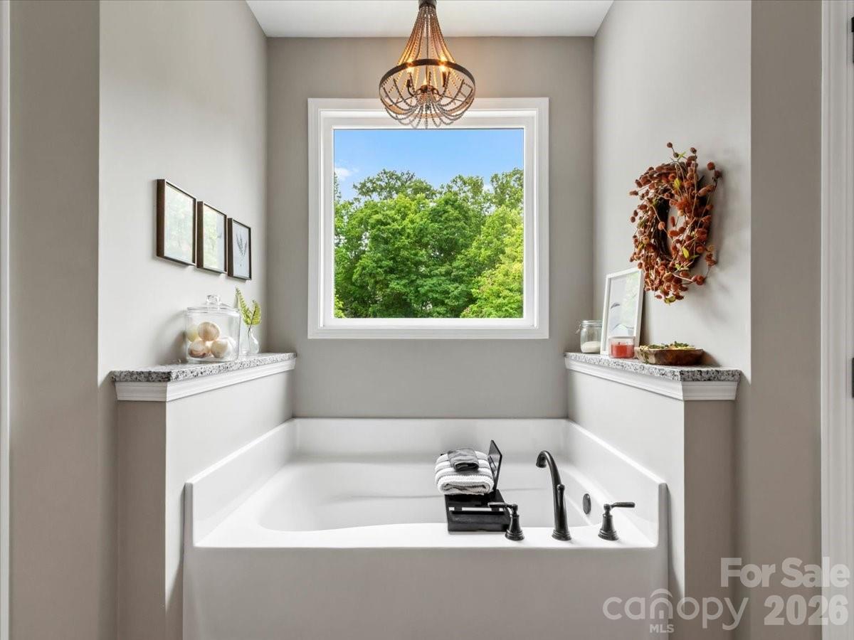 36 Cherry Ridge Lane Weaverville, NC 28787 - Photo 22 of 37 a bathroom with a bathtub sink and window