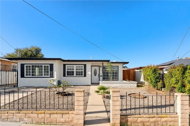 a view of a house with wooden floor and a yard