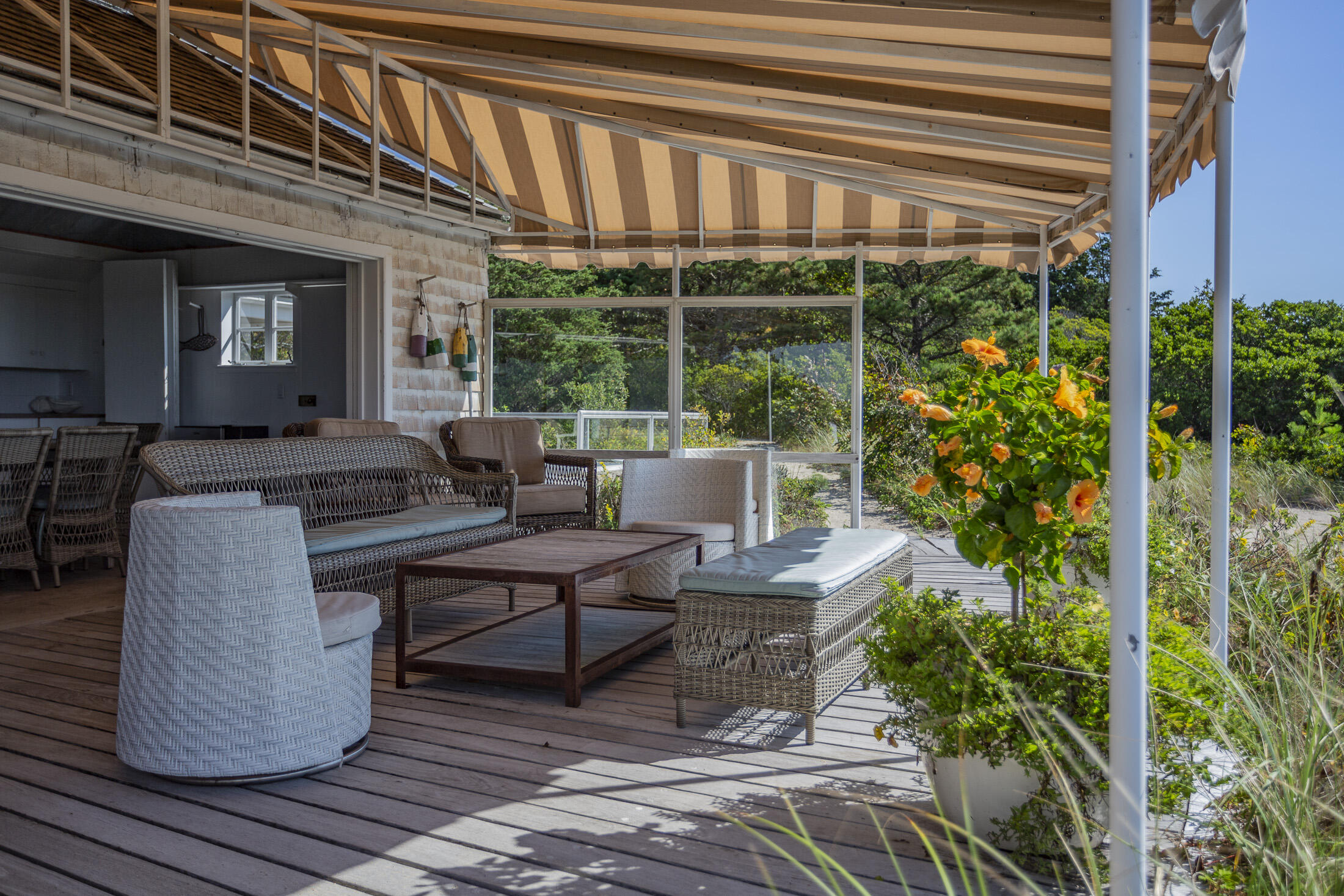 17 Indian Trail Osterville, MA 02655 - Photo 13 of 19 a living room with patio furniture and a potted plants