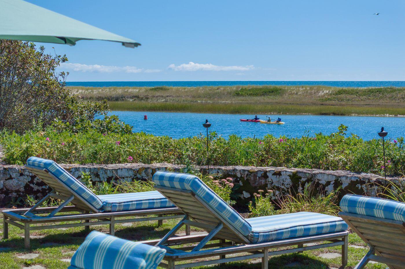 17 Indian Trail Osterville, MA 02655 - Photo 5 of 19 a view of a two chairs on the deck