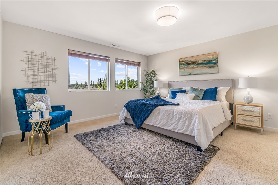 3527 198th Street Southeast Bothell, WA 98012 - Photo 24 of 40 a bedroom with a bed and chair