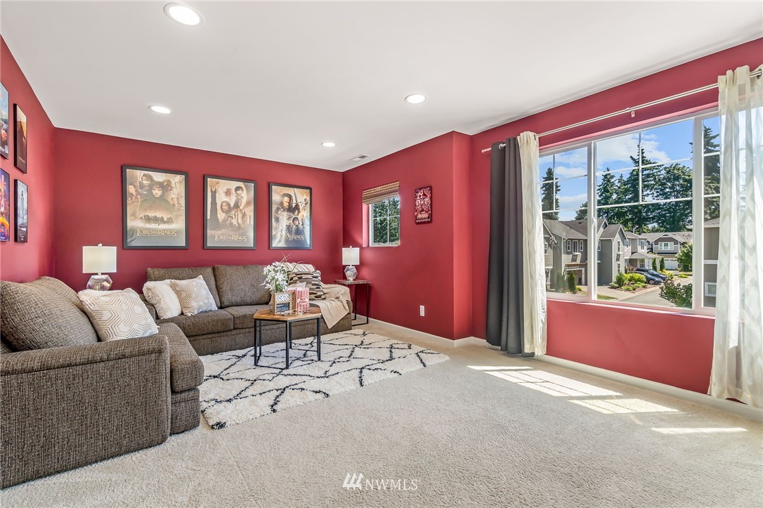 3527 198th Street Southeast Bothell, WA 98012 - Photo 29 of 40 a living room with furniture and a large window