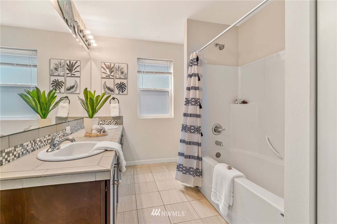 3527 198th Street Southeast Bothell, WA 98012 - Photo 33 of 40 a bathroom with a sink a toilet and shower
