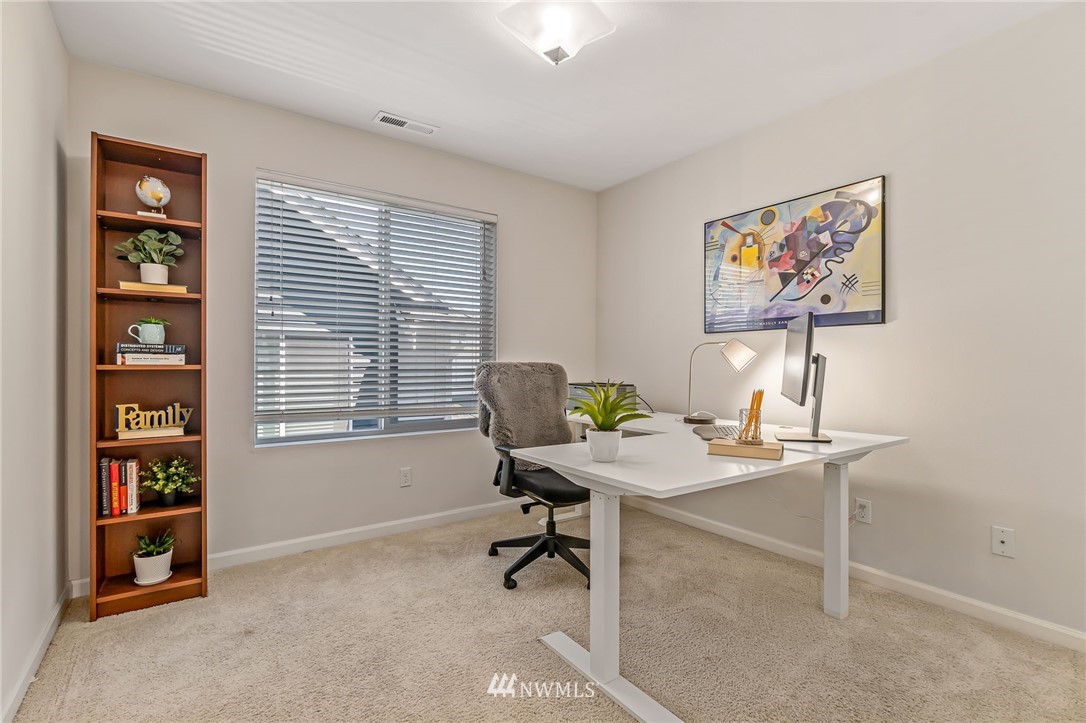 3527 198th Street Southeast Bothell, WA 98012 - Photo 34 of 40 a view of a workspace with furniture and a window
