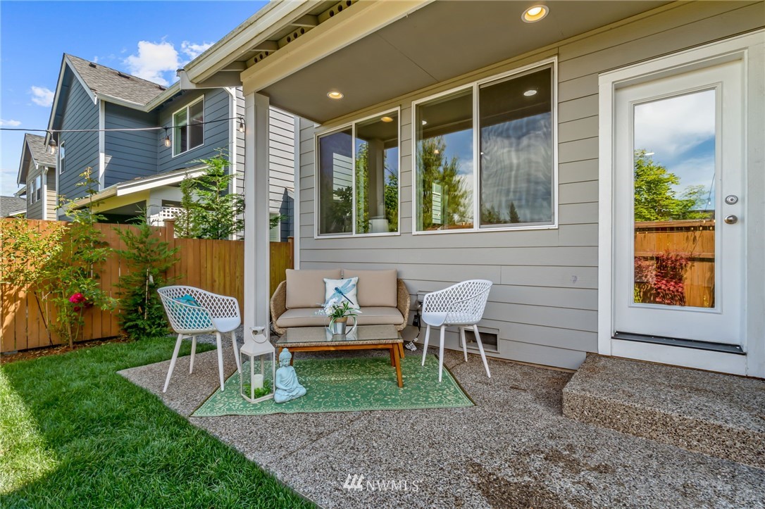 3527 198th Street Southeast Bothell, WA 98012 - Photo 38 of 40 a view of a patio with table and chairs and potted plants