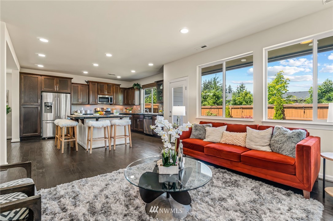 3527 198th Street Southeast Bothell, WA 98012 - Photo 9 of 40 a living room with furniture and a large window