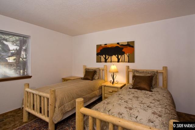 158 A Tramway Drive Stateline, NV 89449 - Photo 7 of 9 a bedroom with a bed and wall painting