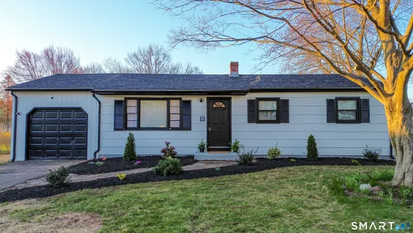 a view of house with yard