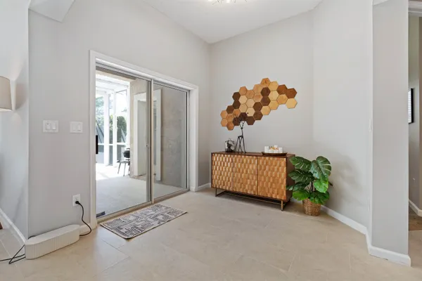 an entryway with a potted plant