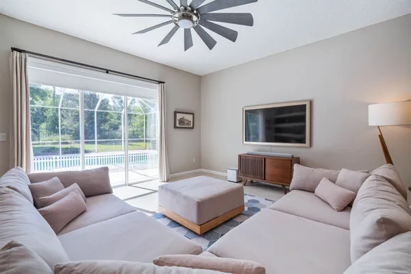 a living room with furniture and a large window