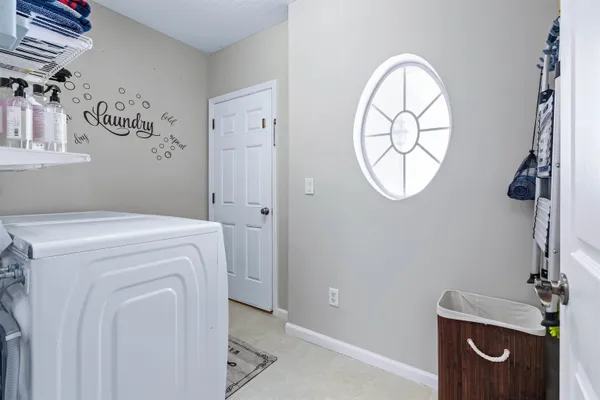 a view of bathroom with a washer and dryer
