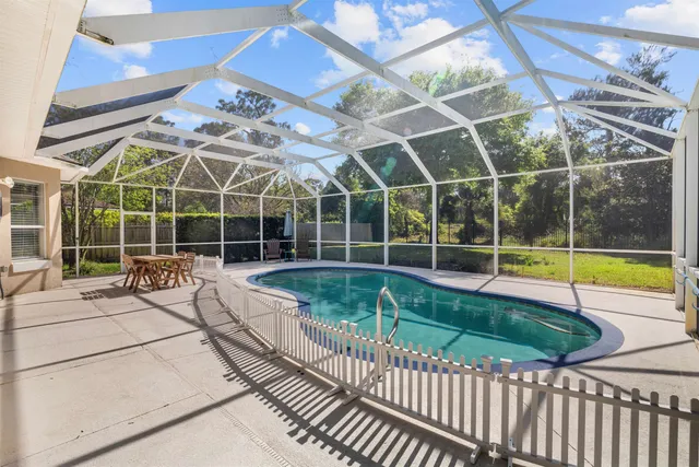 a view of a swimming pool with a porch